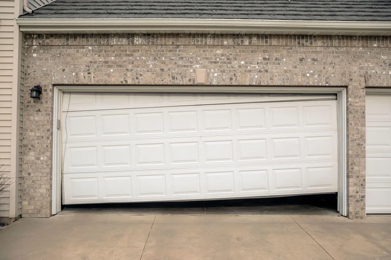 Off-track garage door repair service by Santos & Sons in San Mateo, CA