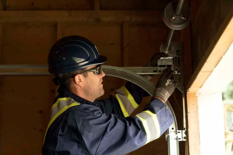 Garage door track repair service in San Mateo by Santos & Sons — straightening bent track