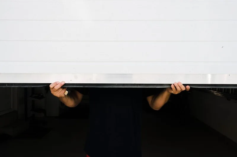 Garage door weather seal replacement by Santos & Sons in San Mateo — new bottom seal installation